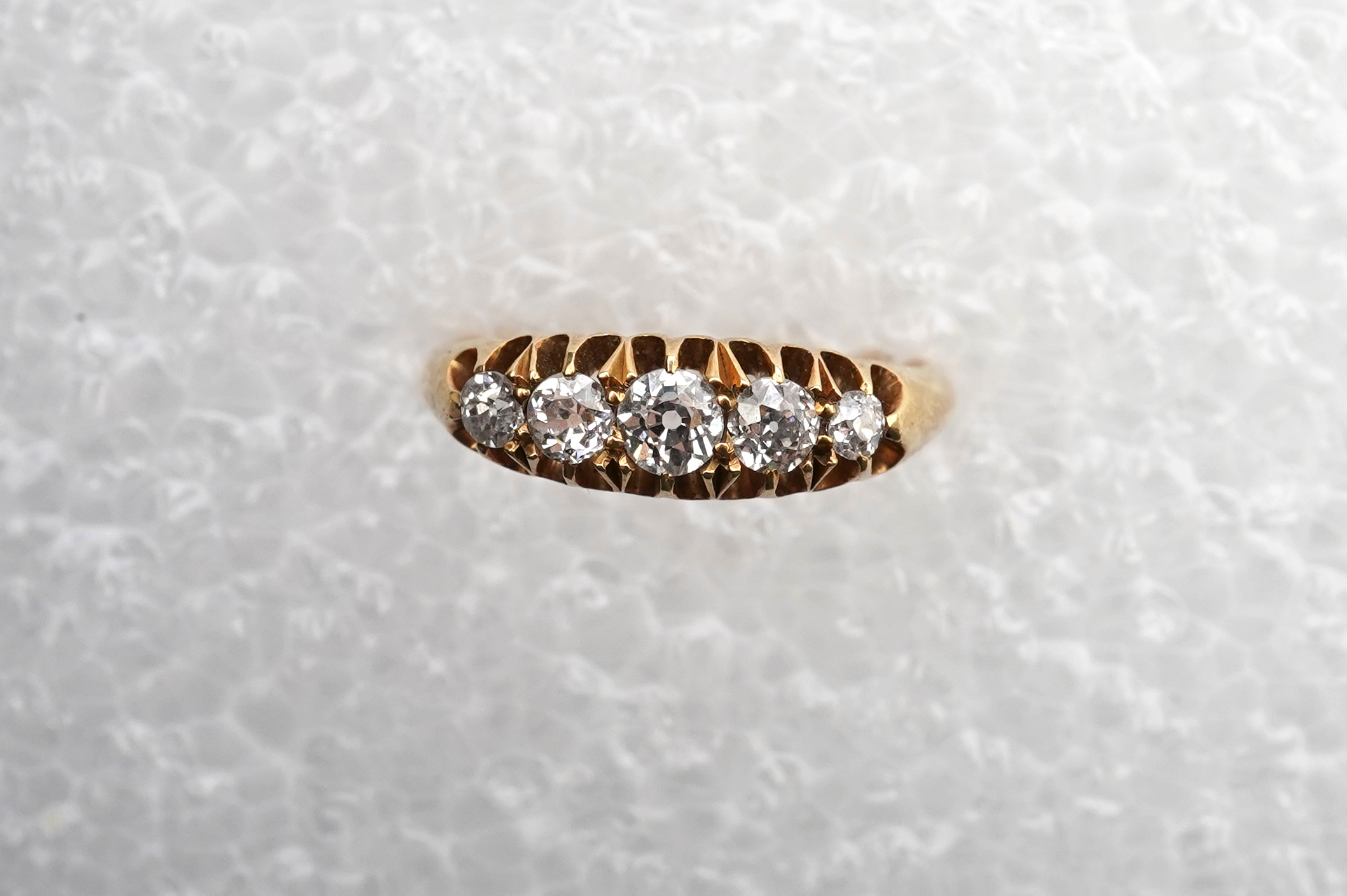 An Edwardian five-stone diamond ring, circa 1903